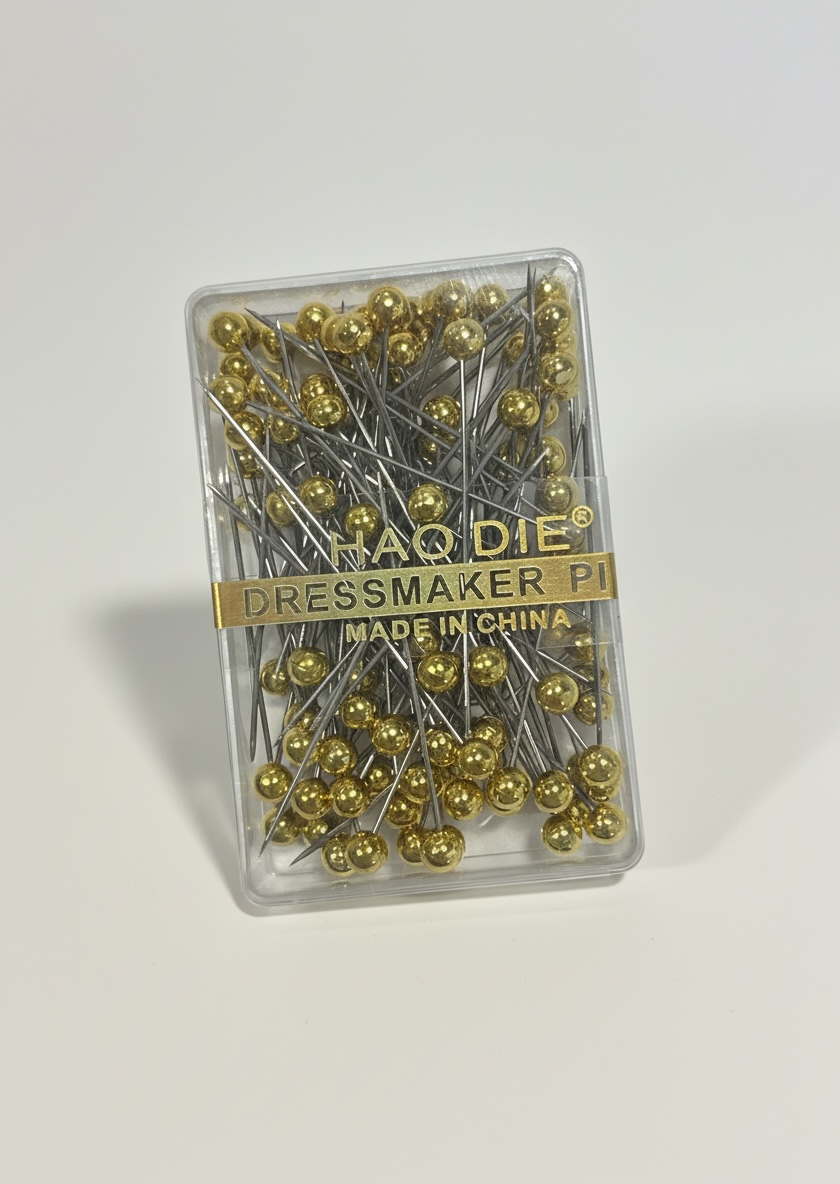 Nadel mit goldenen Kopf